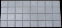 Thirty Two 12.5x12.5mm Silver MF11 Mirror Mosaic Tiles Pictured Reflecting the Sky on an Overcast Day